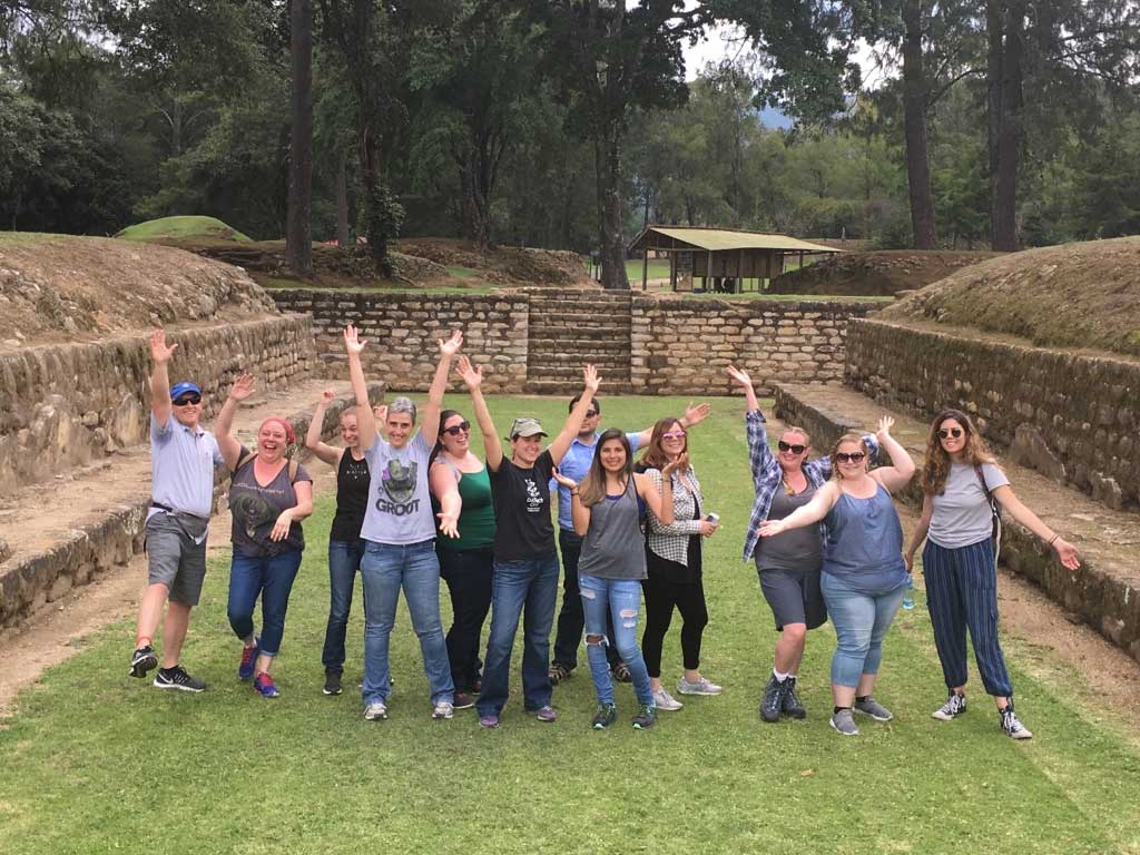 Study abroad participants standing in the ball court.